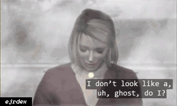 gif of Maria from Silent Hill 2 standing in the thick of the fog saying 'i don't look like a ghost, do i?' and smiling. watermark in the corner
